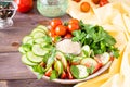 Fresh slices of cucumbers, tomatoes, sesame seeds in a bowl Royalty Free Stock Photo