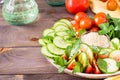 Fresh slices of cucumbers, tomatoes, sesame seeds in a bowl Royalty Free Stock Photo