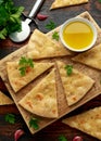 Fresh slices of Garlic pizza on wooden board with herbs Royalty Free Stock Photo