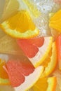 Fresh slices of grapefruit, orange fruit and honey pomelo on white background. Pieces of grapefruit, orange fruit and Royalty Free Stock Photo