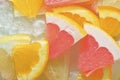 Fresh slices of juicy grapefruit, orange fruit and honey pomelo on white background. Pieces of grapefruit, orange fruit Royalty Free Stock Photo