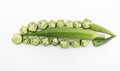 fresh slices and whole of okra or Lady Finger isolate on white background, top view Royalty Free Stock Photo
