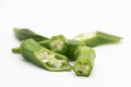 fresh slices and whole of okra or Lady Finger over on white background Royalty Free Stock Photo