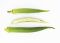 fresh slices and whole of okra or Lady Finger over on white background, top view Royalty Free Stock Photo