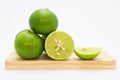 Fresh slide limes on wooden board