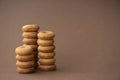 fresh small round donuts on brown background