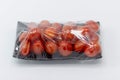 Fresh small tomato which are wrapped with plastic film preservation