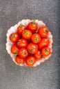Fresh small tomatoes in white salad bowl Royalty Free Stock Photo