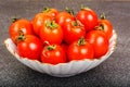 Fresh small tomatoes in white salad bowl Royalty Free Stock Photo