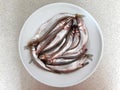 The fresh smelts lie on a plate