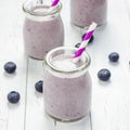 Smoothie with blueberry, banana, oats, almond milk and yogurt, square format