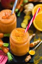 Fresh smoothie with carrot, apple, orange, banana, ginger and tu Royalty Free Stock Photo