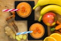 Fresh smoothie with carrot, apple, orange, banana, ginger and tu Royalty Free Stock Photo