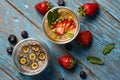 Fresh smoothie with passion fruit with currant and strawberries, close-up Royalty Free Stock Photo
