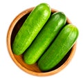 Fresh snack cucumbers, small and young cucumber fruits in wooden bowl Royalty Free Stock Photo