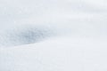 Fresh snow background texture. Winter background with snowflakes and snow mounds. Snow lumps.