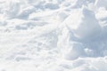 Fresh snow background texture. Winter background with snowflakes and snow mounds. Snow lumps