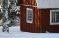 Fresh snow giving a mantle to a beautiful playhouse and trees in the garden