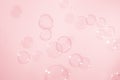 Fresh of soap bubbles floating in the air, on pink background Royalty Free Stock Photo