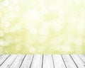 Fresh soft green spring background with white bokeh and white wooden planks