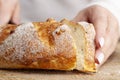 a fresh soft loaf of bread cut into pieces with a knife Royalty Free Stock Photo