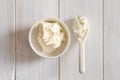 Fresh soft mascarpone cheese in a white bowl