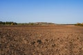 Fresh soil, arable land and blue sky
