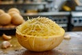 Fresh Spaghetti Squash Shredded on Kitchen Counter with Raw Eggs and Garlic in Background Royalty Free Stock Photo
