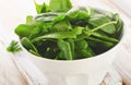 Fresh spinach leaves in white bowl Royalty Free Stock Photo
