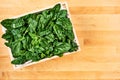 Fresh spinach leaves in wooden box Royalty Free Stock Photo