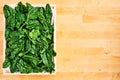 Fresh spinach leaves in wooden box Royalty Free Stock Photo
