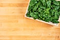 Fresh spinach leaves in wooden box Royalty Free Stock Photo