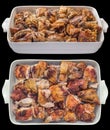 Freshly Spit Roasted Pork Thigh Meat Slices in White Oblong Ceramic Casserole Baking Pan Isolated on Black Background