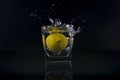 Fresh splash lemon in glass isolated on black Royalty Free Stock Photo