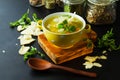 Fresh split pea soup with crackers and herbs