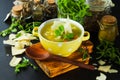 Fresh split pea soup with crackers and herbs
