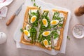 Fresh spring tart with green peas and asparagus on puff pastry Royalty Free Stock Photo