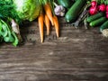 Fresh Spring vegetables and herbs frame on rustic wood background. Spring harvest of fresh vegetables. Copy space Royalty Free Stock Photo