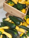 Fresh squash in wooden container for sale