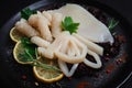 Fresh squid , raw, carcass, cut into rings, top view, no people, Royalty Free Stock Photo