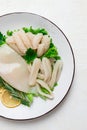 Fresh squid , raw, carcass, cut into rings, top view, no people, Royalty Free Stock Photo