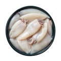 Fresh squid tubes in a blue bowl cutout. Raw calamary fillet on a plate isolated on a white background. Small squids prepared for Royalty Free Stock Photo