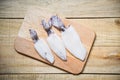 Fresh squid on wooden cutting board top view Raw squid on wooden table background Royalty Free Stock Photo