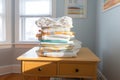 fresh stack of diapers on a changing table