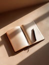 Fresh Start Idea With Clean Open Notebook on a Beige Table Under Spring Shadows Offering a Positive Mood for Creativity Royalty Free Stock Photo