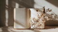 Fresh Start Idea With Open Notebook on Beige Table Featuring Spring Shadows and a Branch of Flowers Creating a Positive Royalty Free Stock Photo
