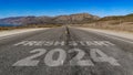 Fresh Start 2024 written on highway road to the mountain Royalty Free Stock Photo