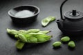 Fresh steamed edamame sprinkled with sea salt on a stone tabletop Royalty Free Stock Photo