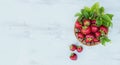 Fresh strawberries in a basket on rustic wooden background top view. Healthy food on white wooden table mockup. Delicious, sweet, Royalty Free Stock Photo