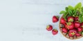 Fresh strawberries in a basket on rustic wooden background top view Royalty Free Stock Photo